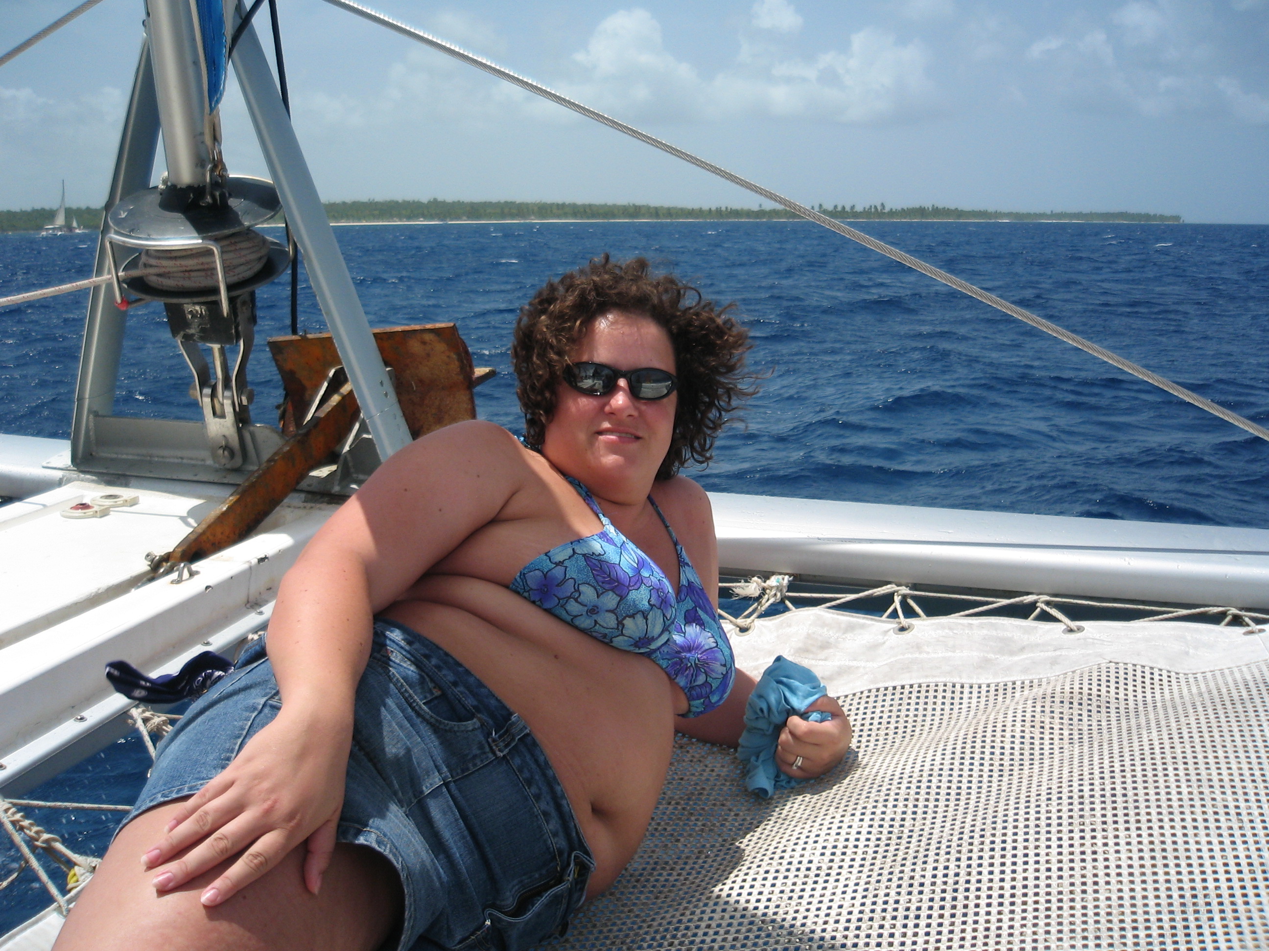 Katie on the net at the front of the Catamaran