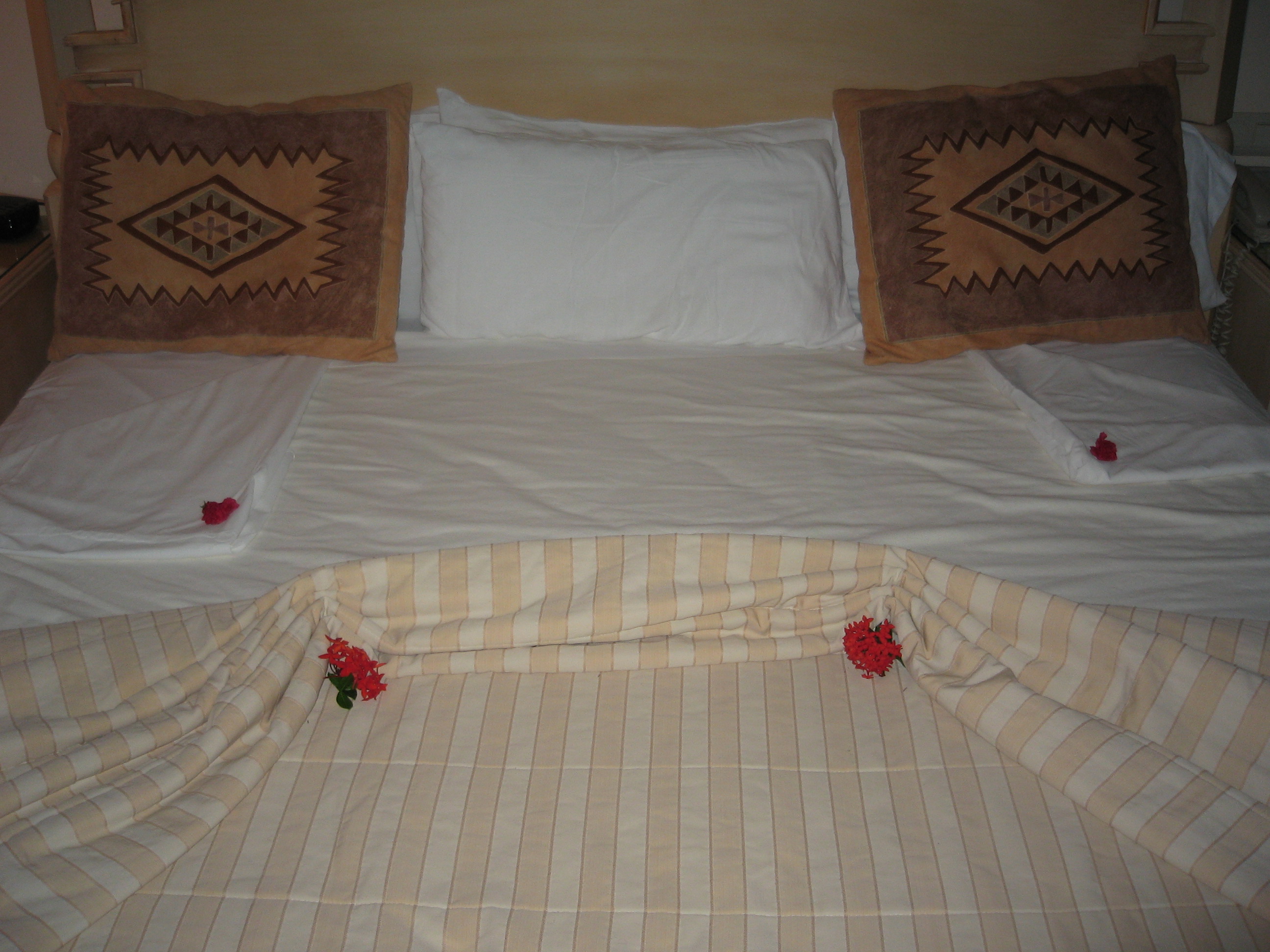 bed turned down with flowers